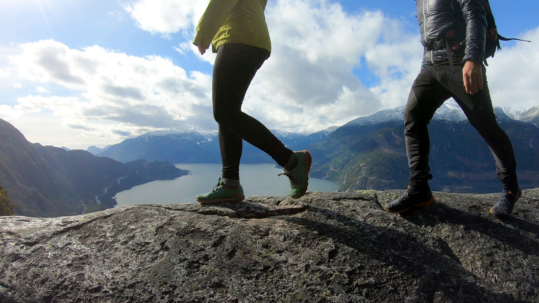 Mountaineers walk along mountain ridge