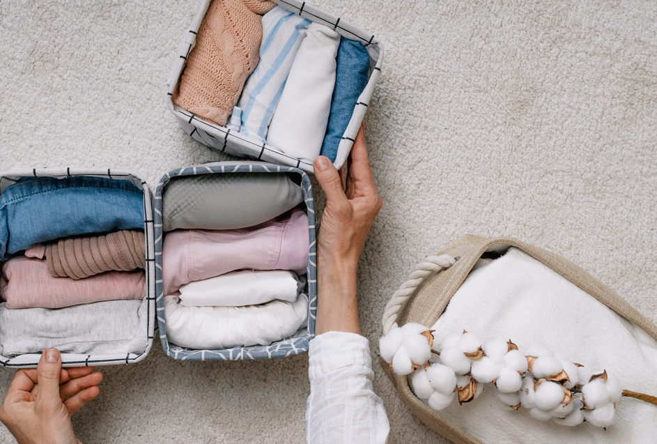 Neatly Folded Clothes in Open Organizer Boxes