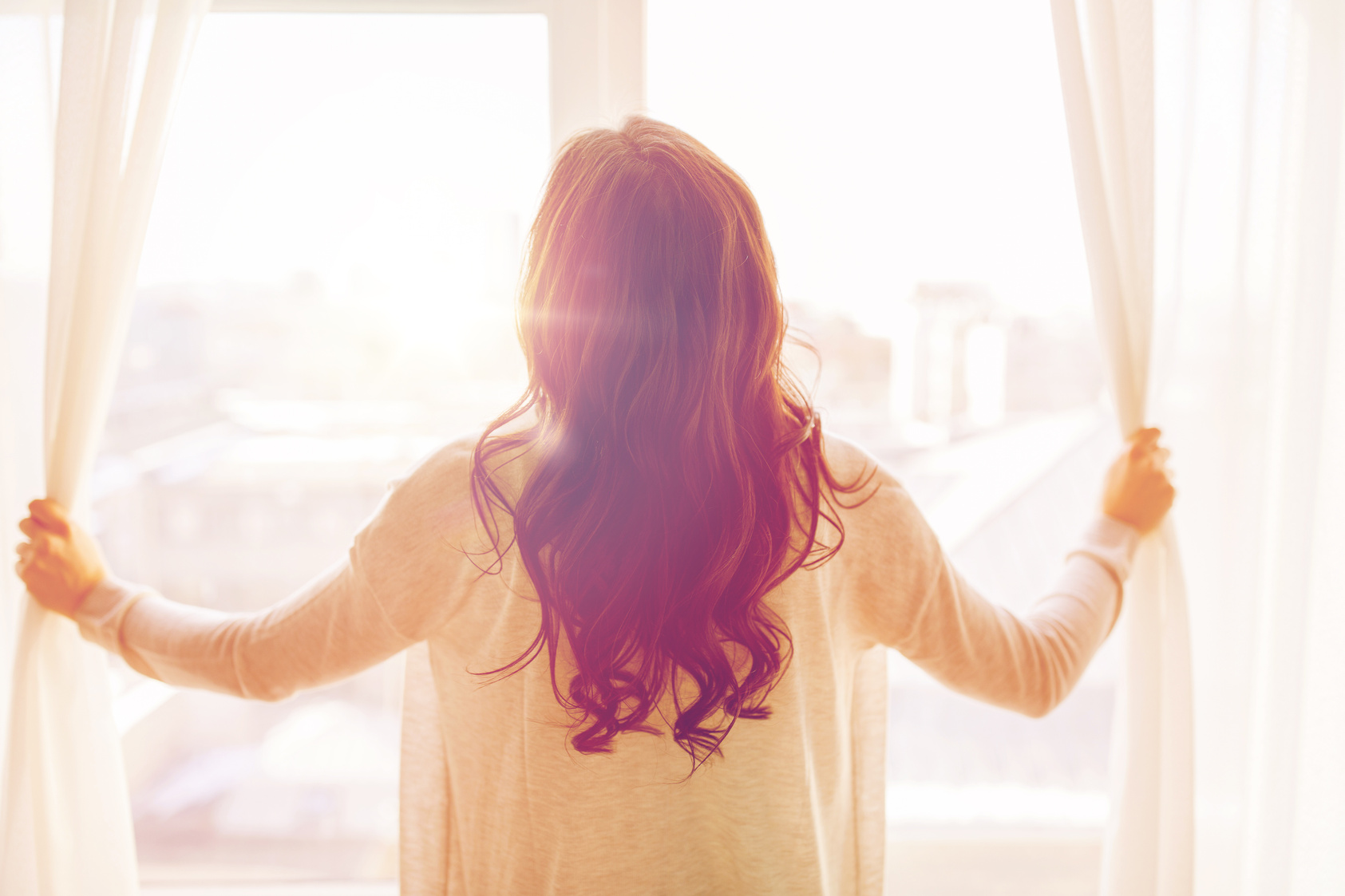 Close up of Woman Opening Window Curtains