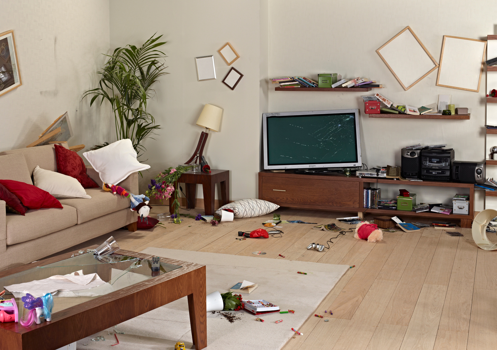 messy living room with damage