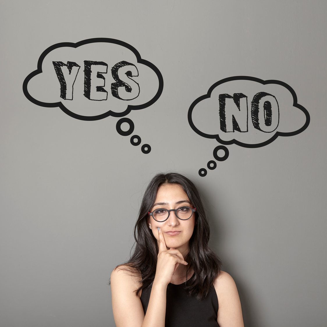 Young woman is trying to decide between yes or no.