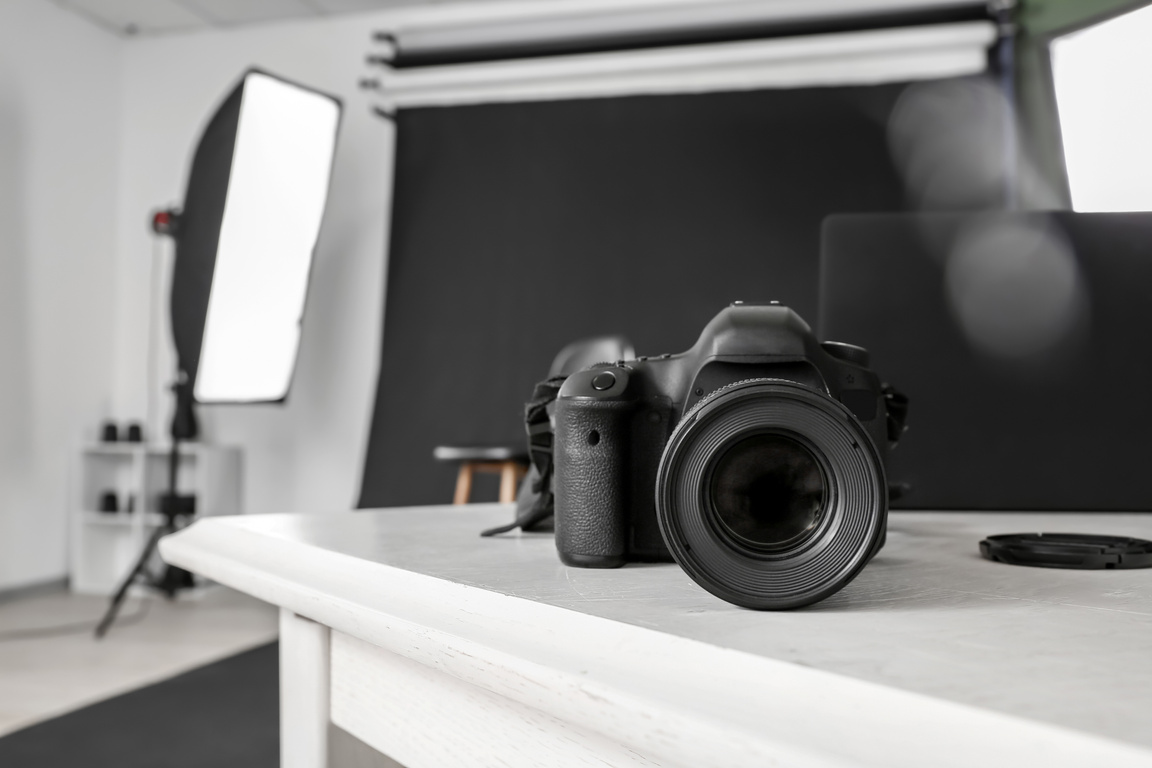 Modern Camera on Table in Professional Photo Studio