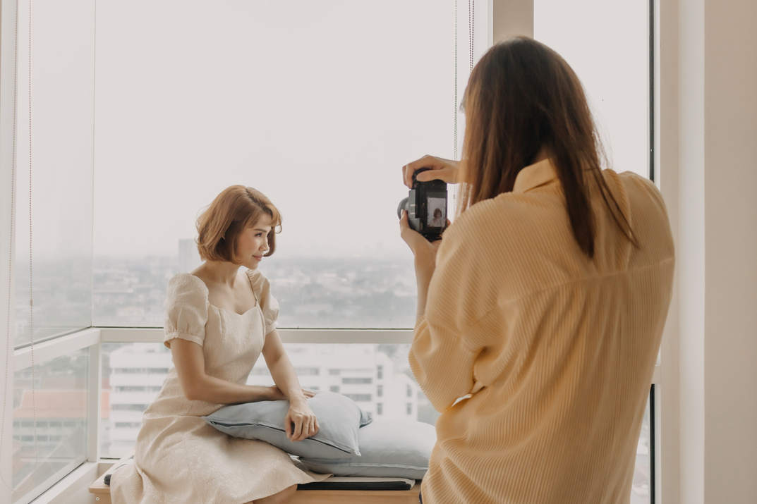 Female Photographer Taking a Photo of Female Model