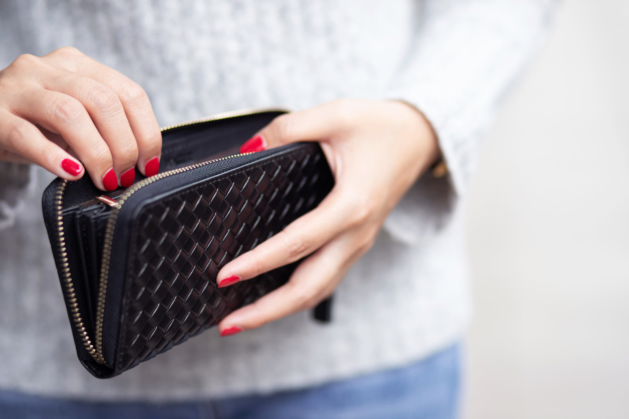 Woman Holding Empty Wallet
