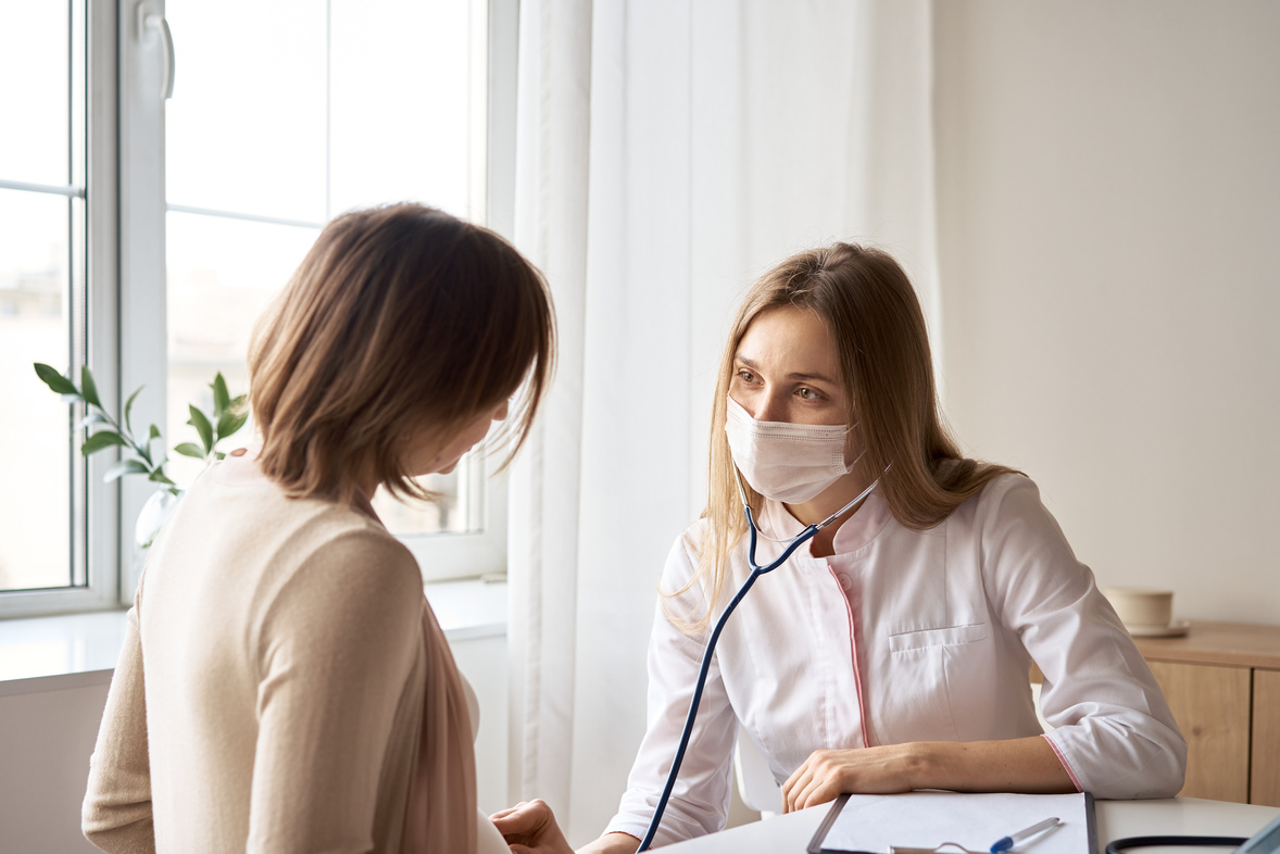 Doctor Consulting with Pregnant Woman 